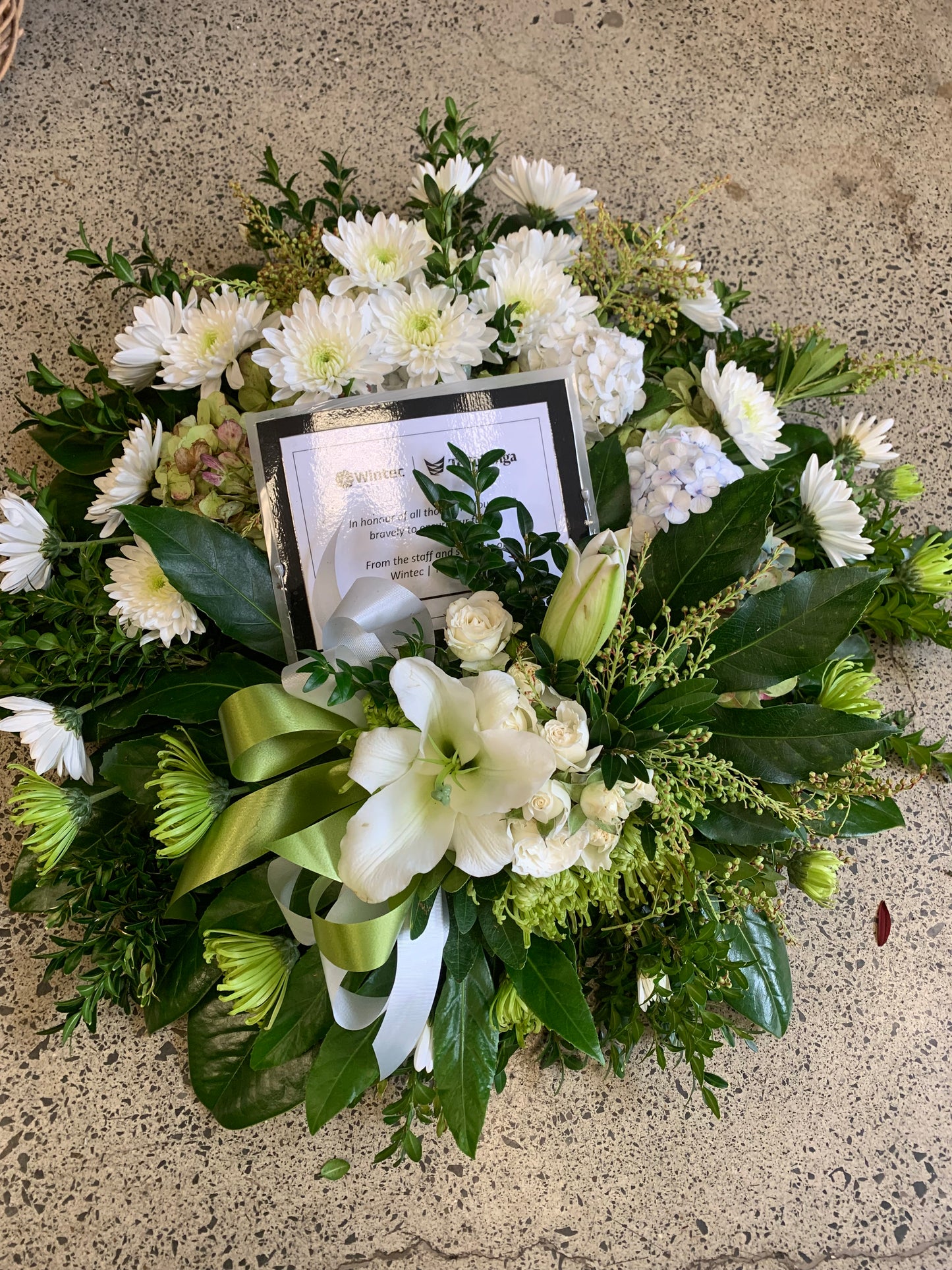 White Wreath with Lily. Perfect for funerals and memorials.