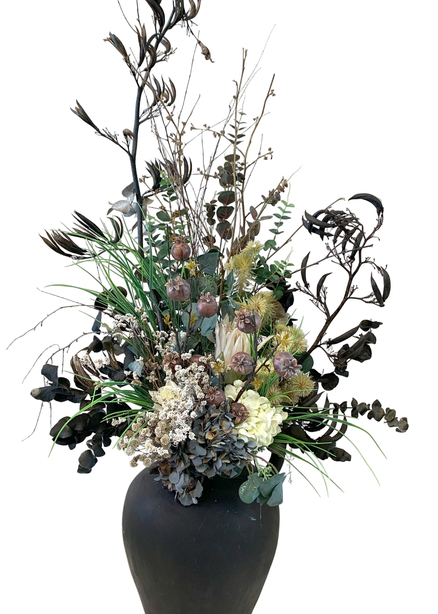 Dried arrangement in black jug
