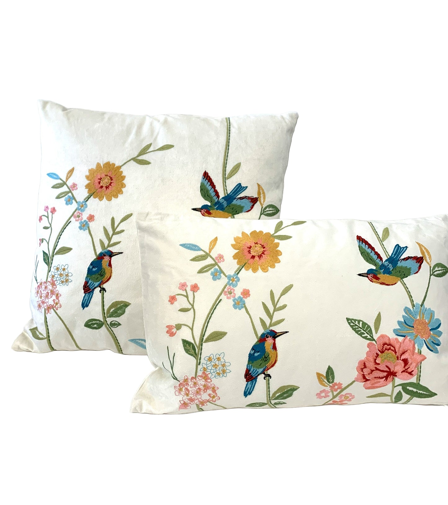 Two decorative pillows with floral and bird patterns on a white background