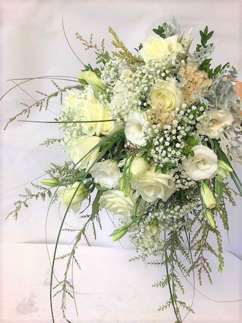 White and cream bunch of wedding flowers for a bride
