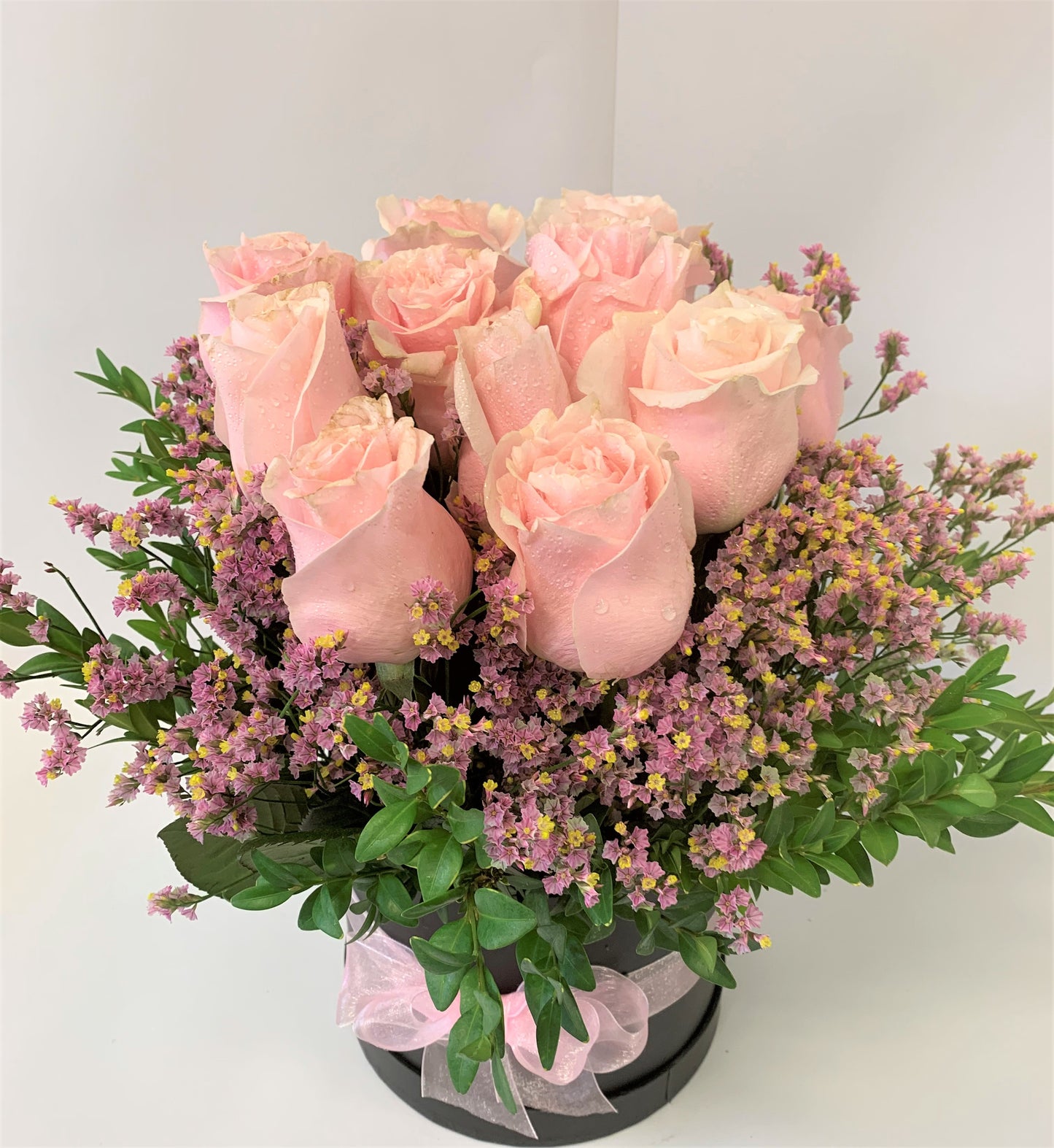 12 Beautiful pink roses in water in a decorative box for your special friend or lover for Valentines day. Delivery in Hamilton or Throughout New Zealand.