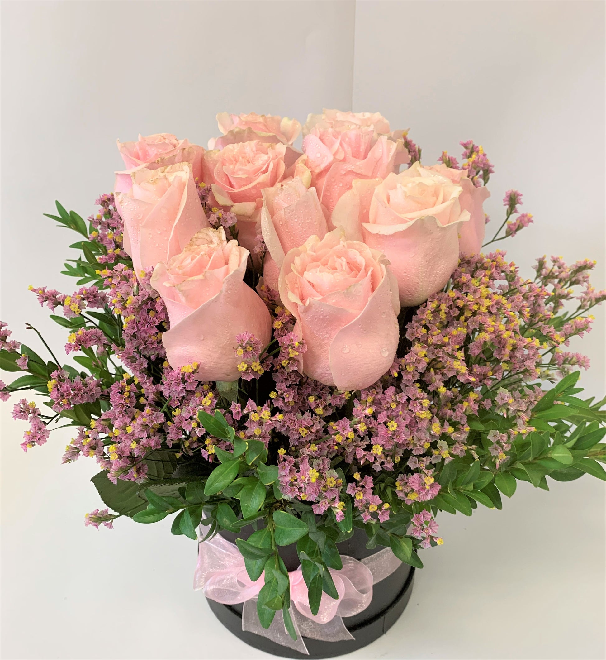 12 Beautiful pink roses in water in a decorative box for your special friend or lover for Valentines day.      Delivery in Hamilton or Throughout New Zealand. 