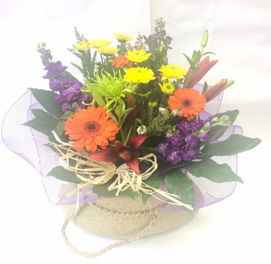 Colourful Mix of Fresh Flowers in Kete Bag