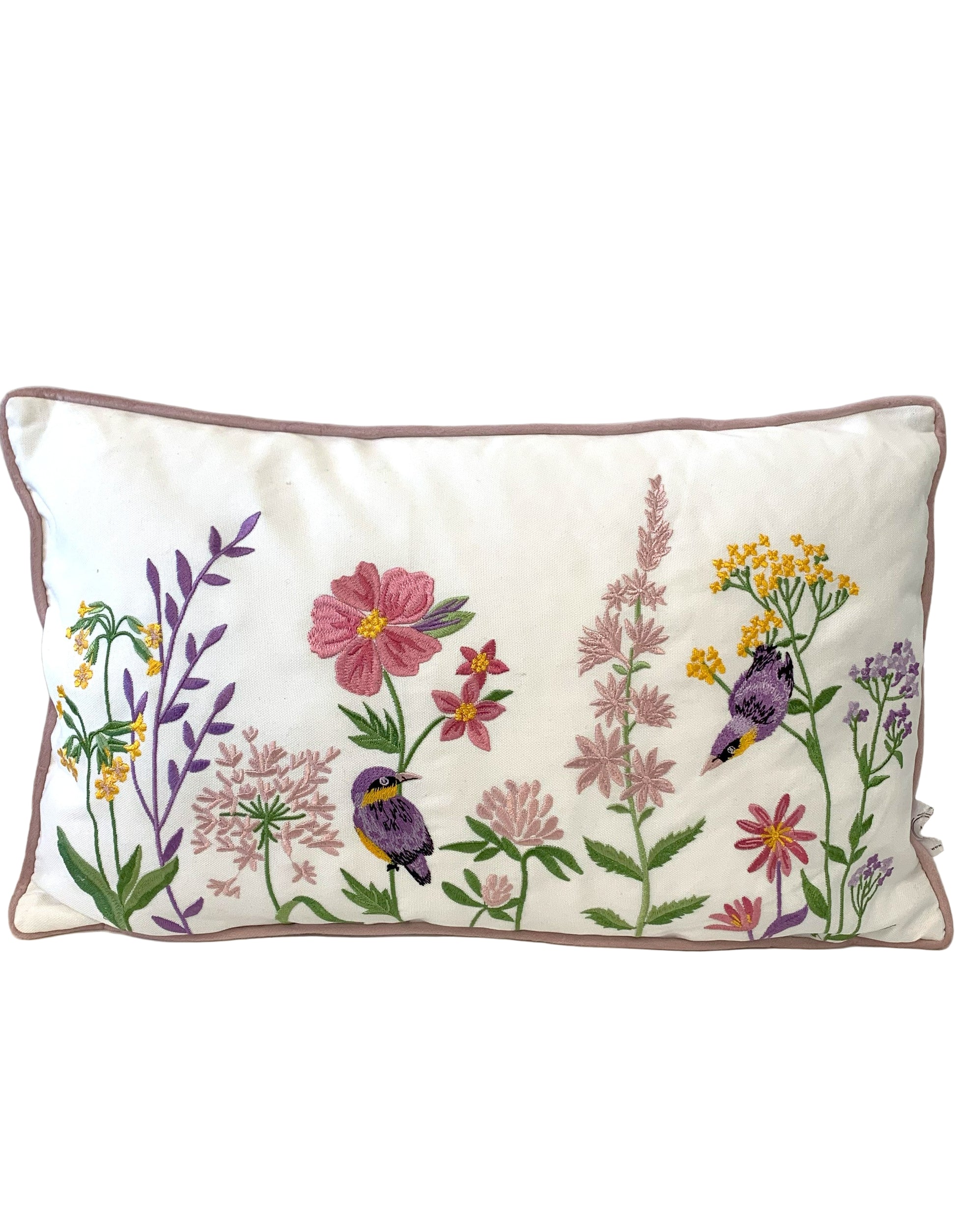 Decorative pillow with floral and bird embroidery on a textured surface