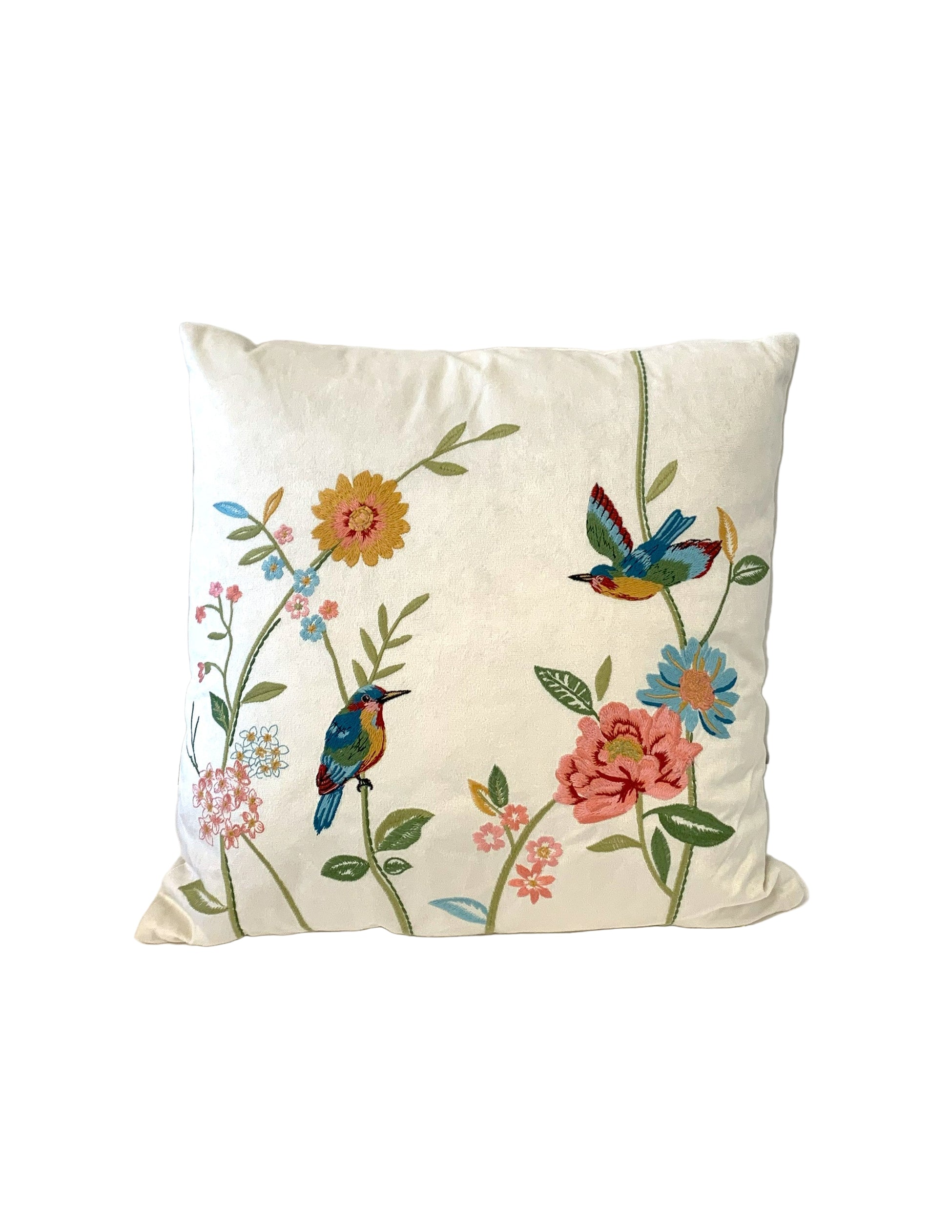 Decorative pillow with floral and bird design on a white background