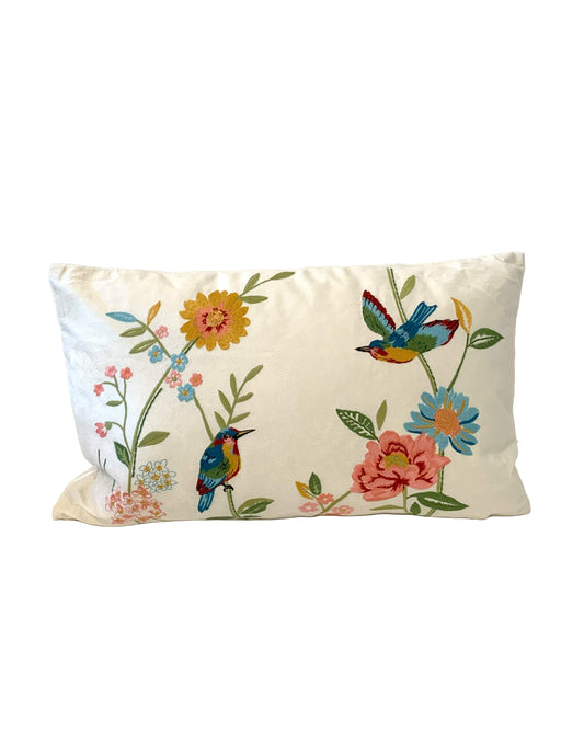 Decorative pillow with colorful birds and flowers on a white background