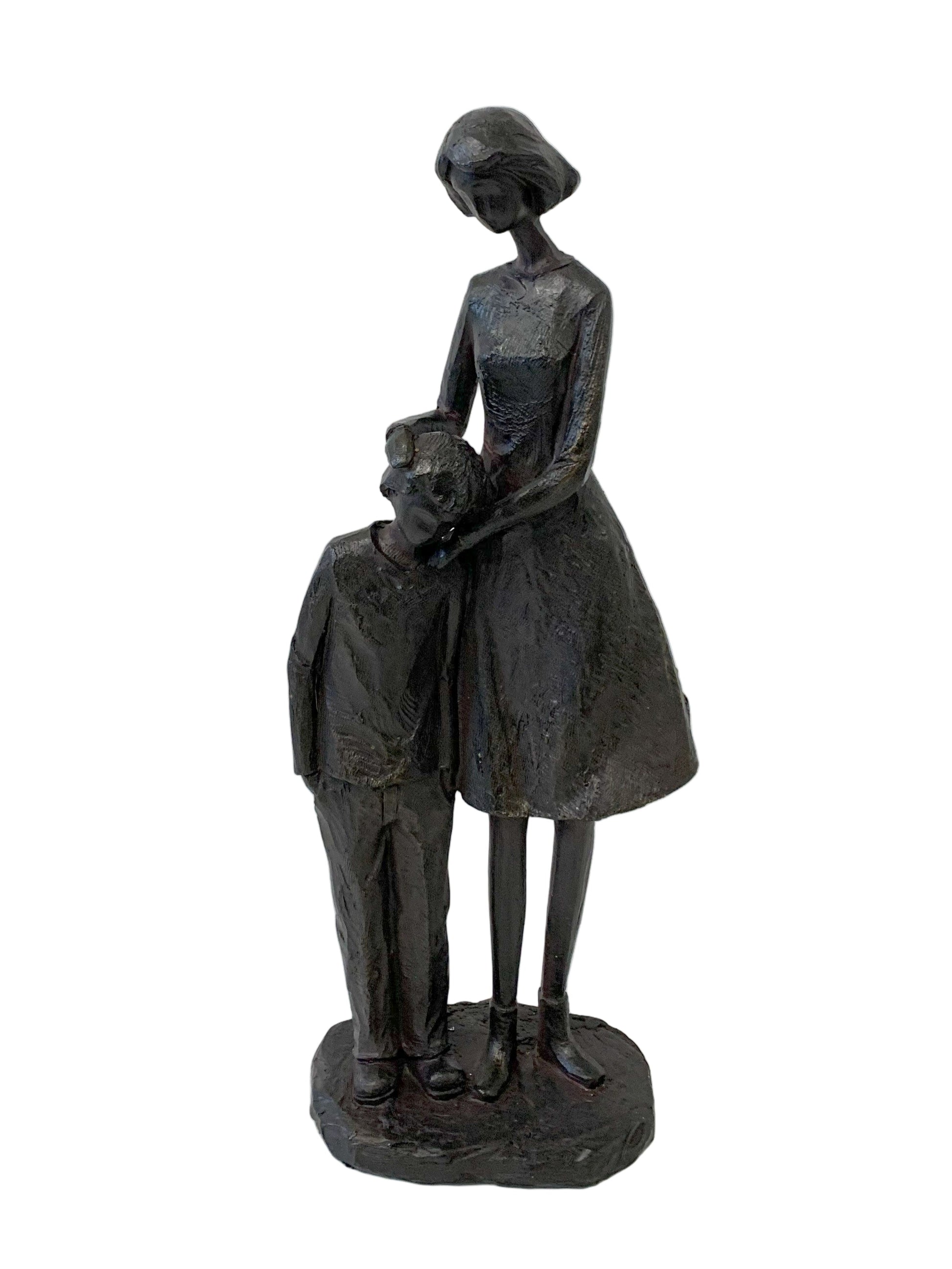 Statue of a woman holding a child on a white background