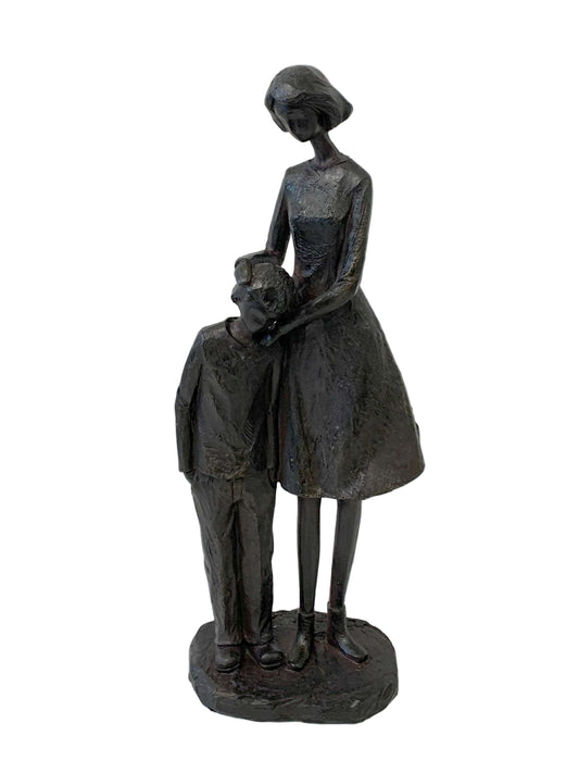Statue of a woman holding a child on a white background
