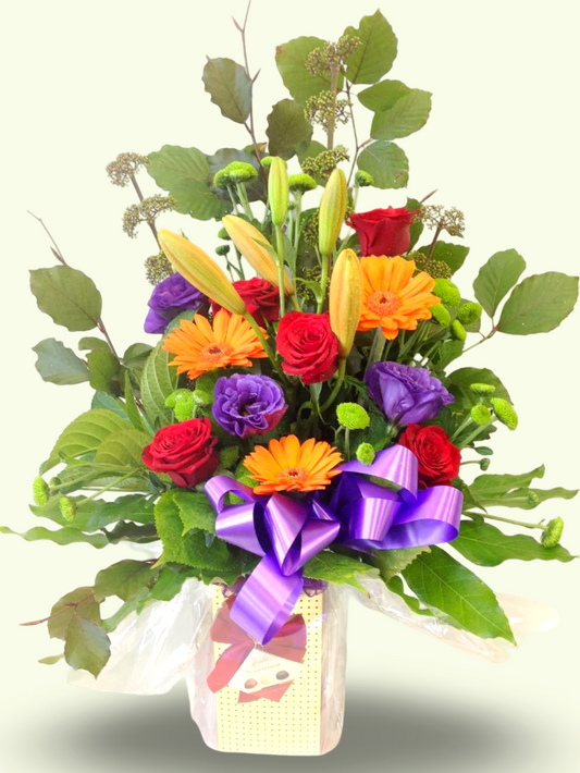 Selection of Bright Flowers Hand Tied With Chocolates