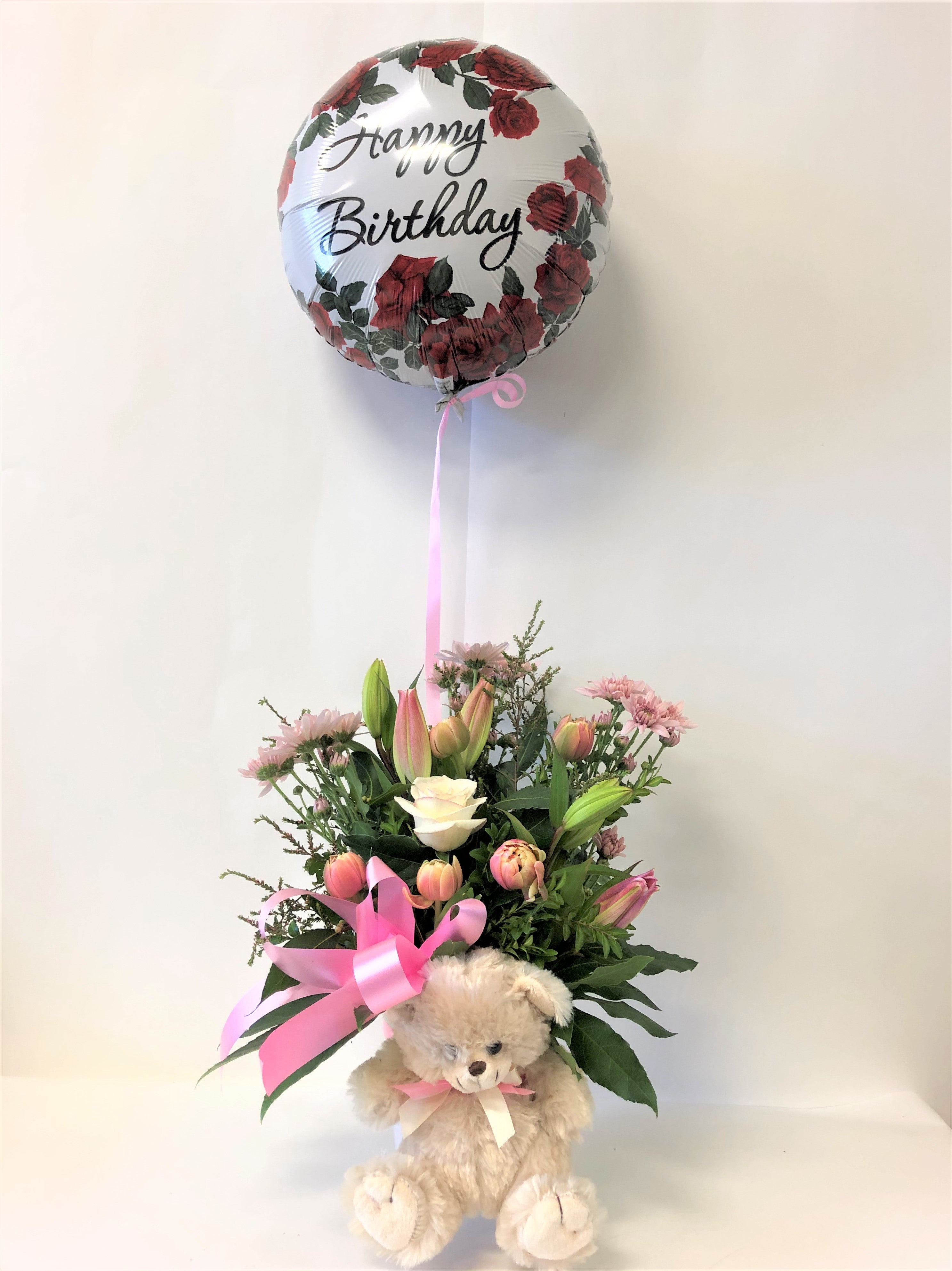 Happy birthday flowers and shop teddy bear