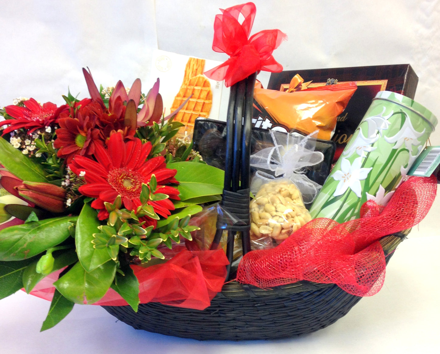 Flowers and gourmet treats in basket