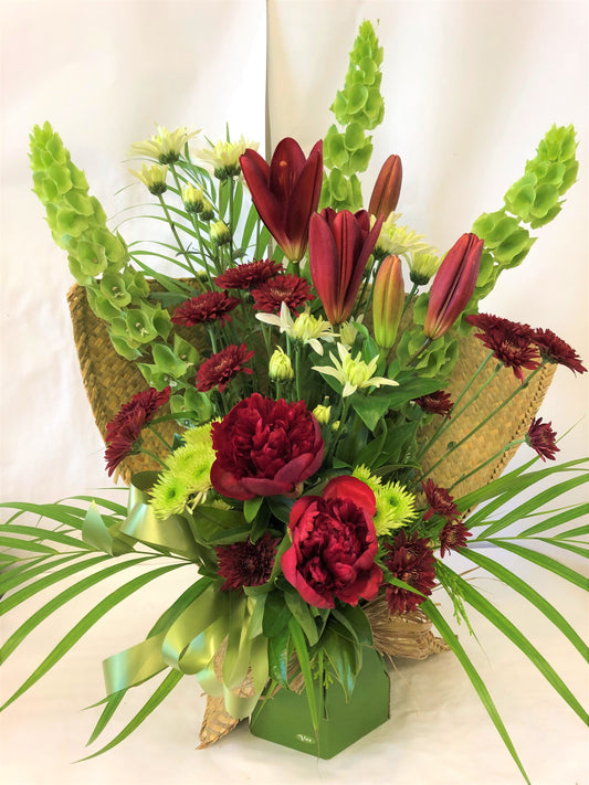 Water box with Native Flax wrap with greens and reds with palm. Great for a graduation gift, or Whanau Family gift. 