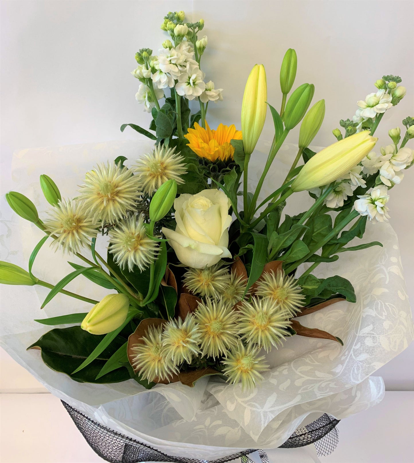 Green, white and yellow hand-tied flowers for sympathy or get well      Delivery throughout New Zealand 