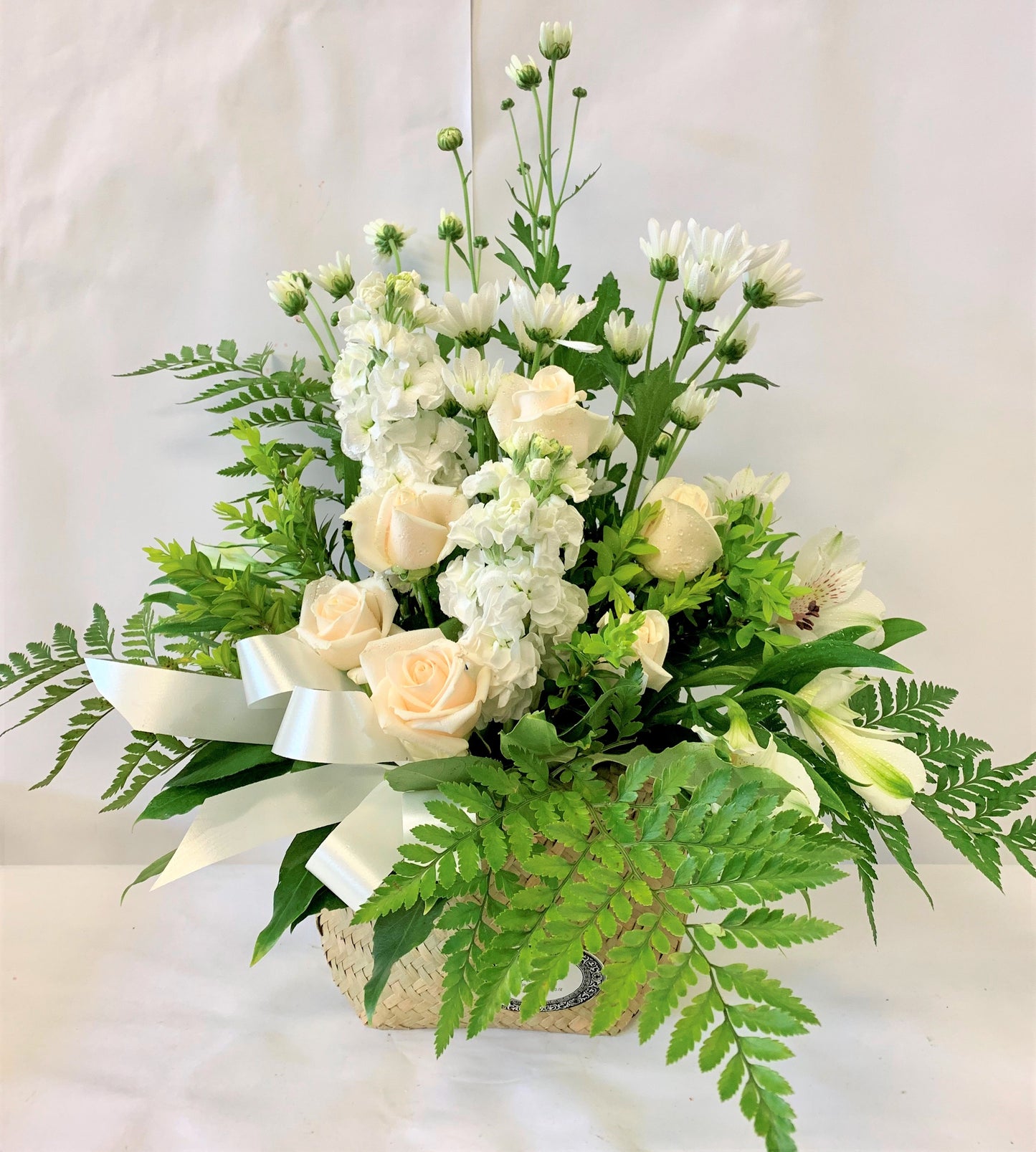 Sympathy flowers with native ferns and stock roses, whanua gift or sympathy gift